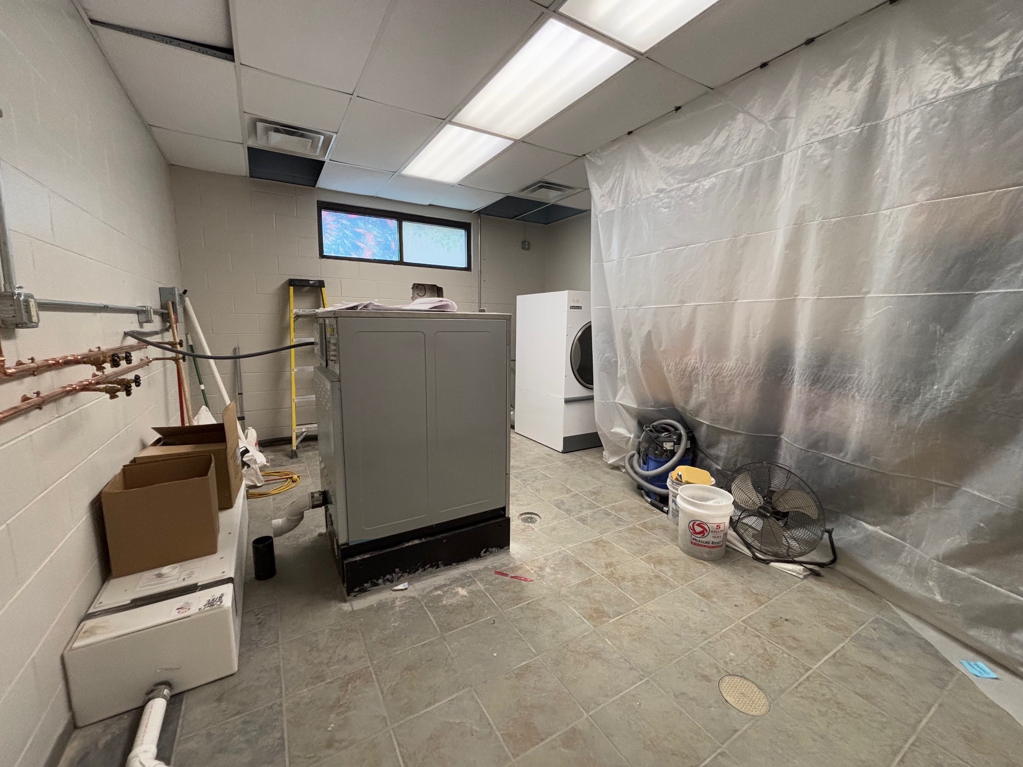 Washer and dryer animal shelter room