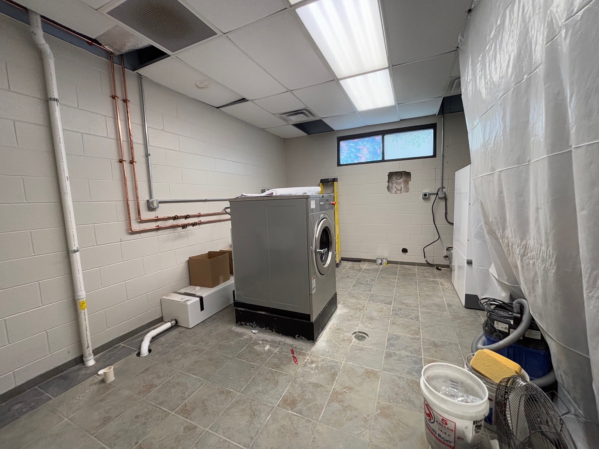 Washer and dryer animal shelter room